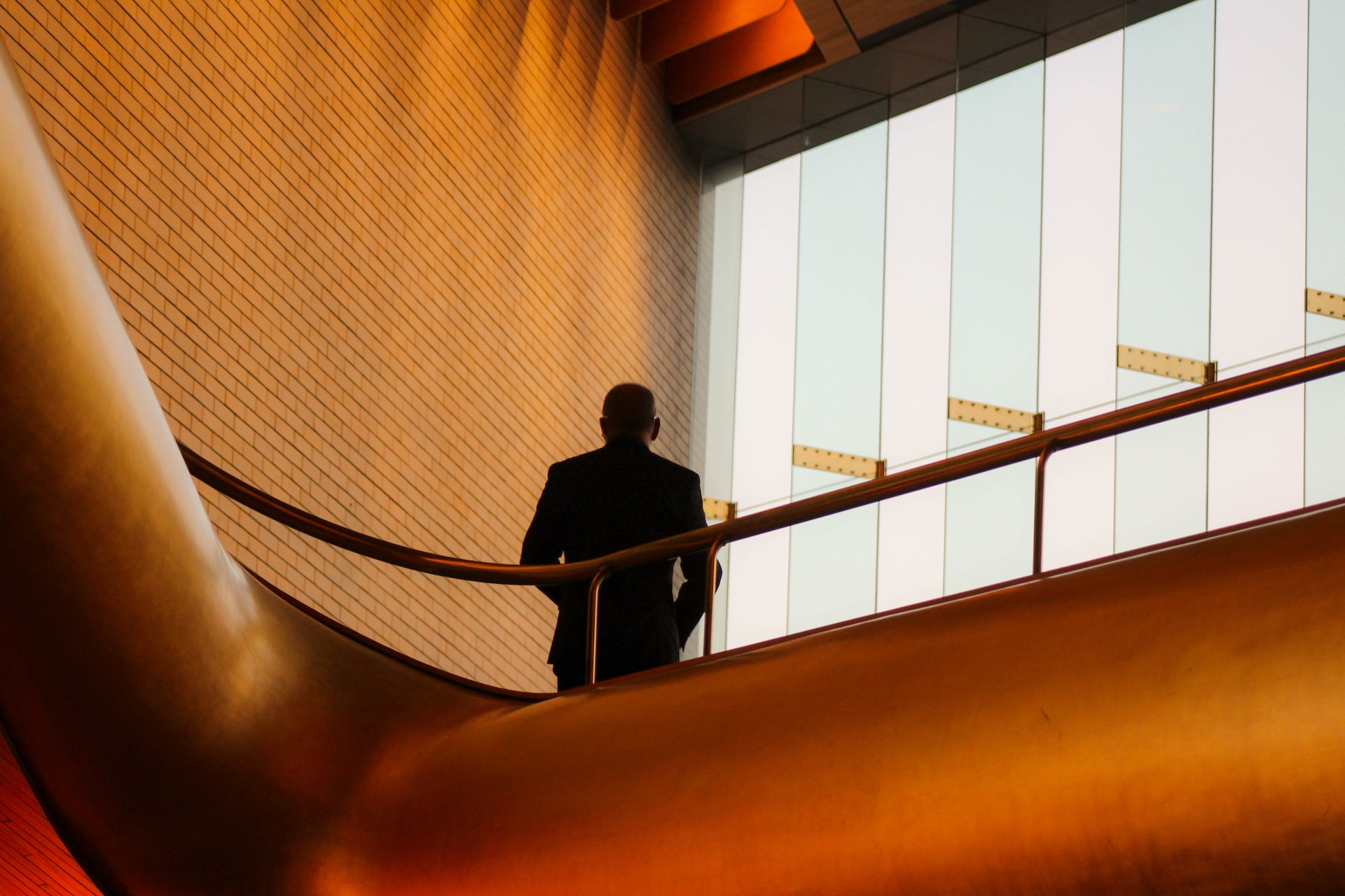 Man dressed in suit photographed from below implying leadership