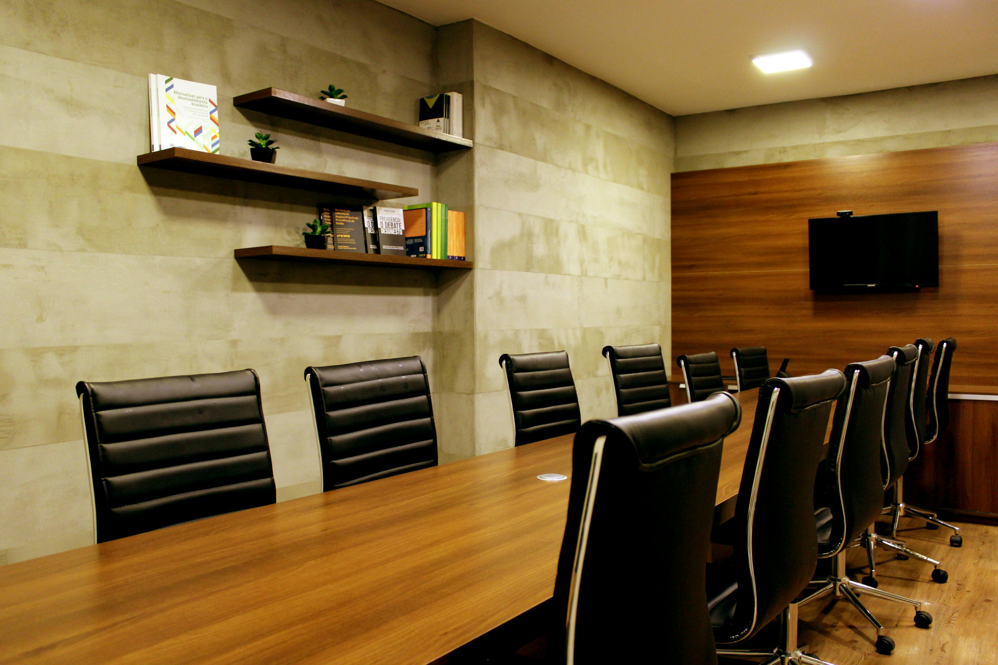 Black chairs in a well lit boardroom